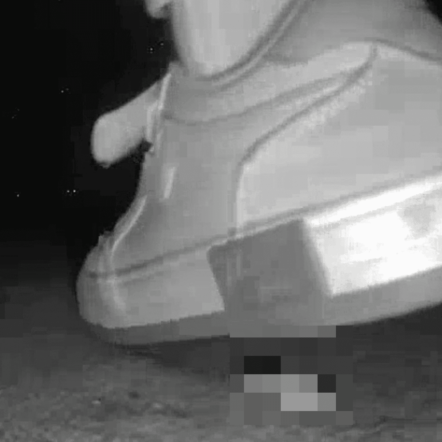 Young woman in cinema candid crush with sneakers and stuck to her sole