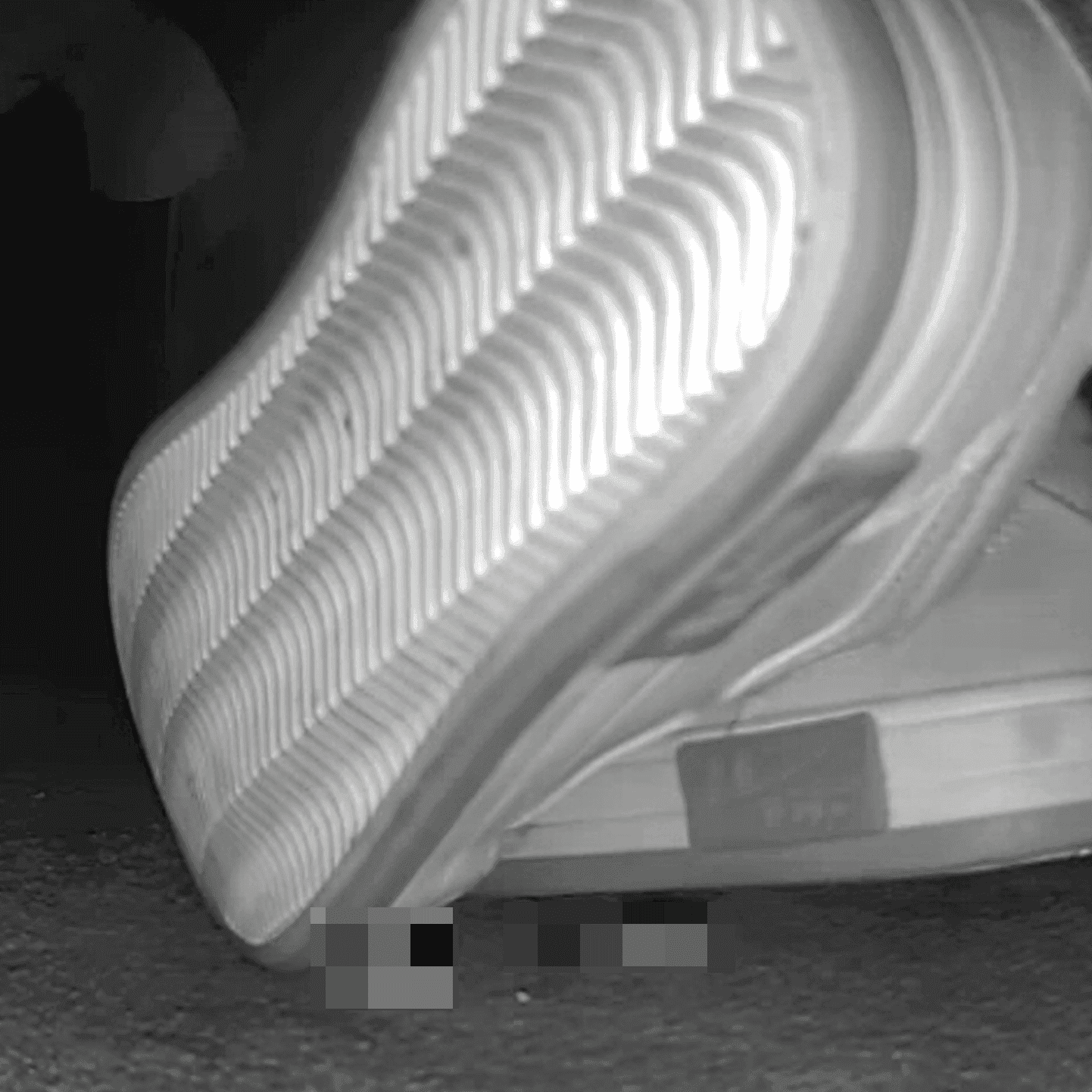 Young woman in cinema candid crush with sneakers and stuck to her sole