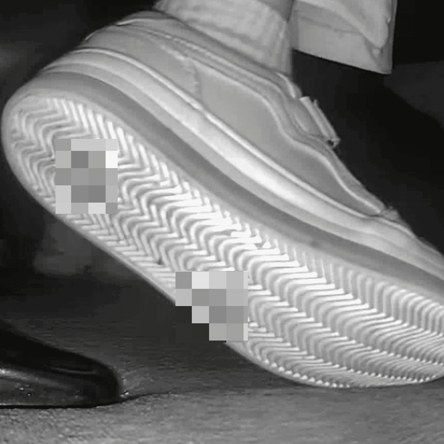 Young woman in cinema candid crush with sneakers and stuck to her sole