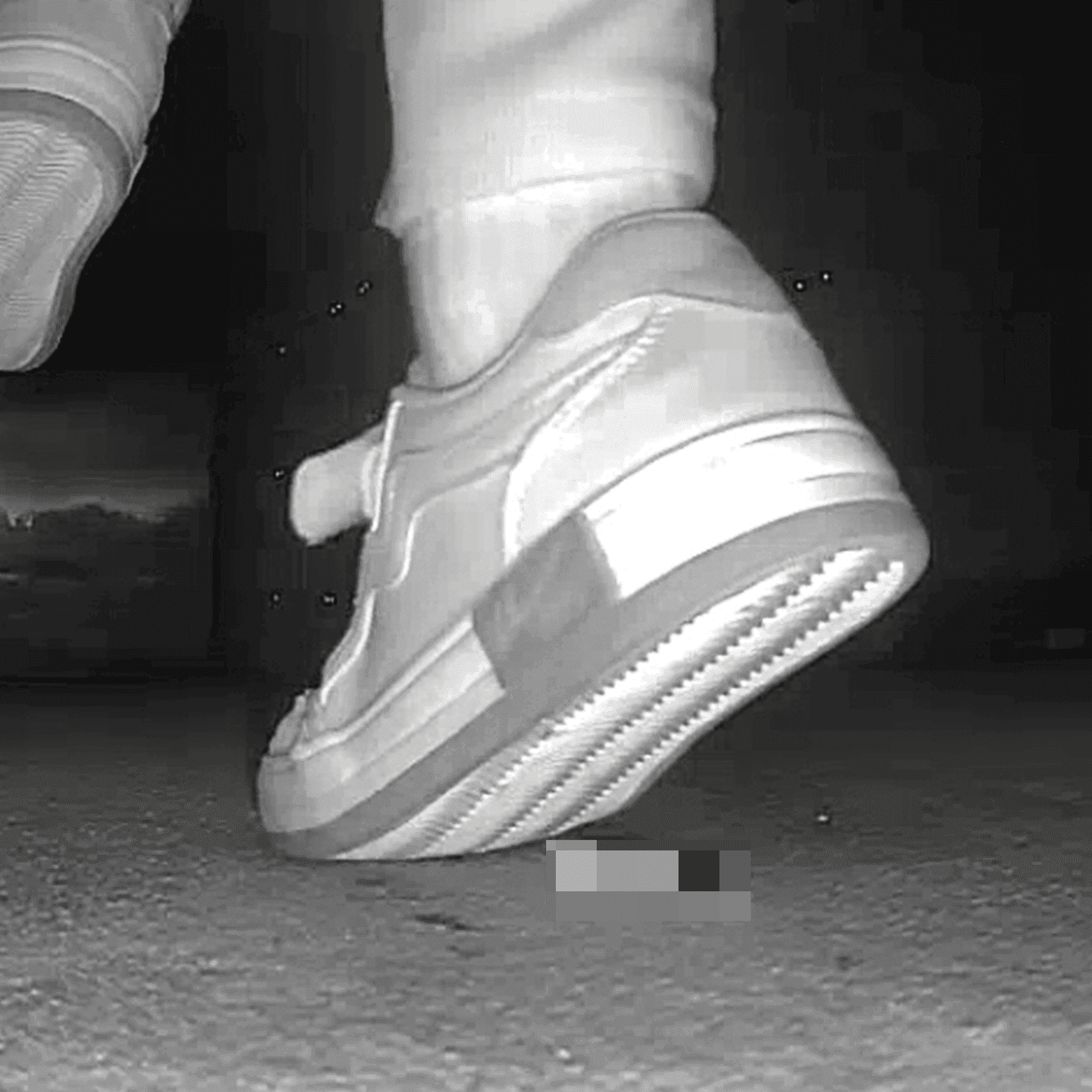 Young woman in cinema candid crush with sneakers and stuck to her sole