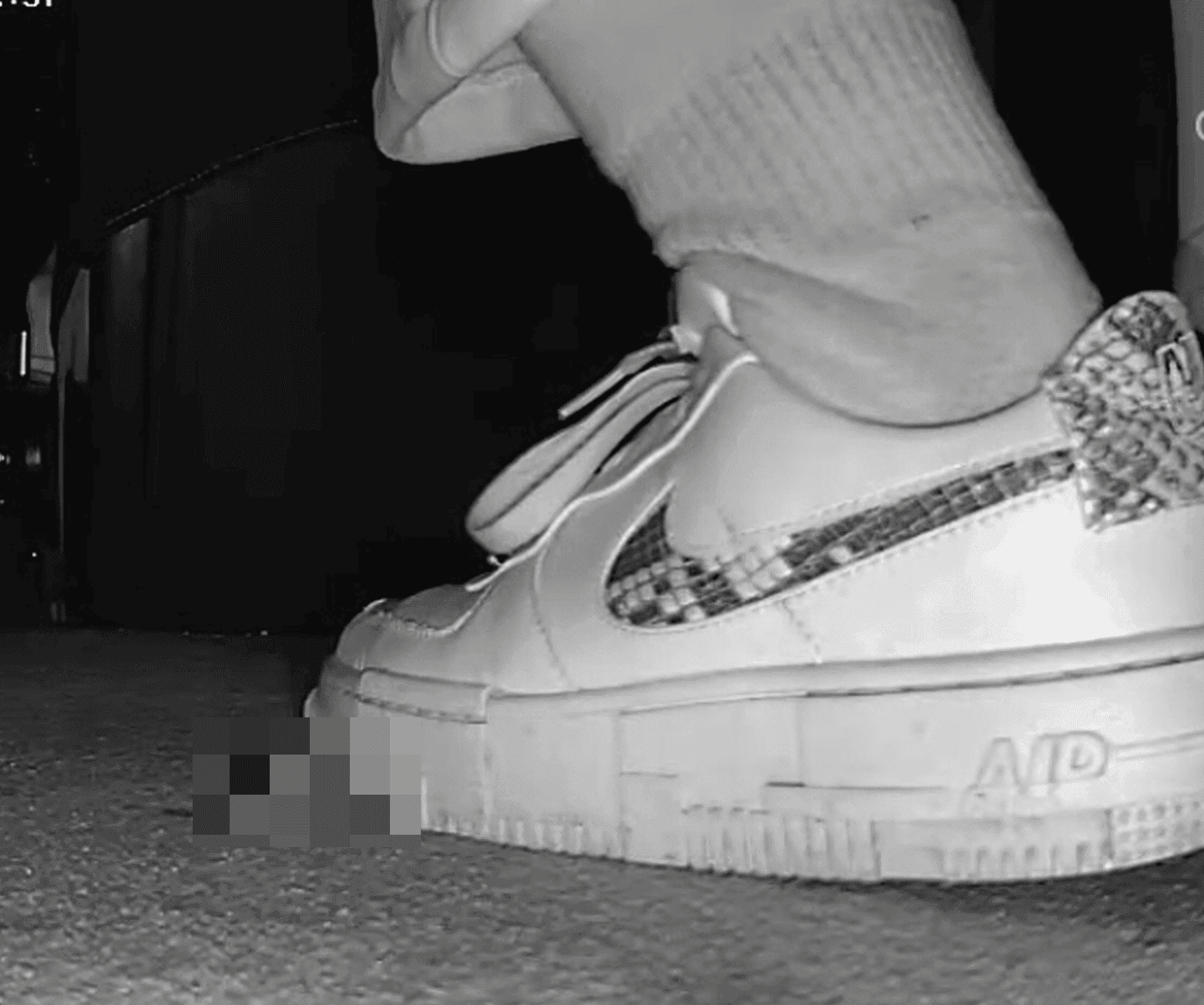 Girl in a cinema candid crush with Nike sneaker