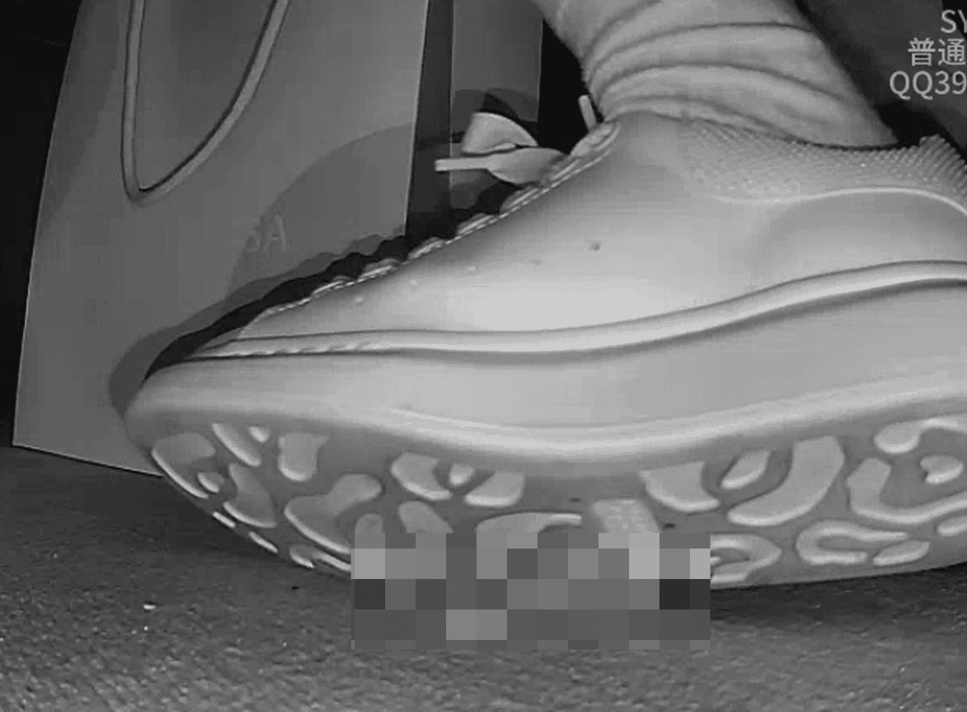 Woman candid crush with white socks and McQueen sneakers in cinema