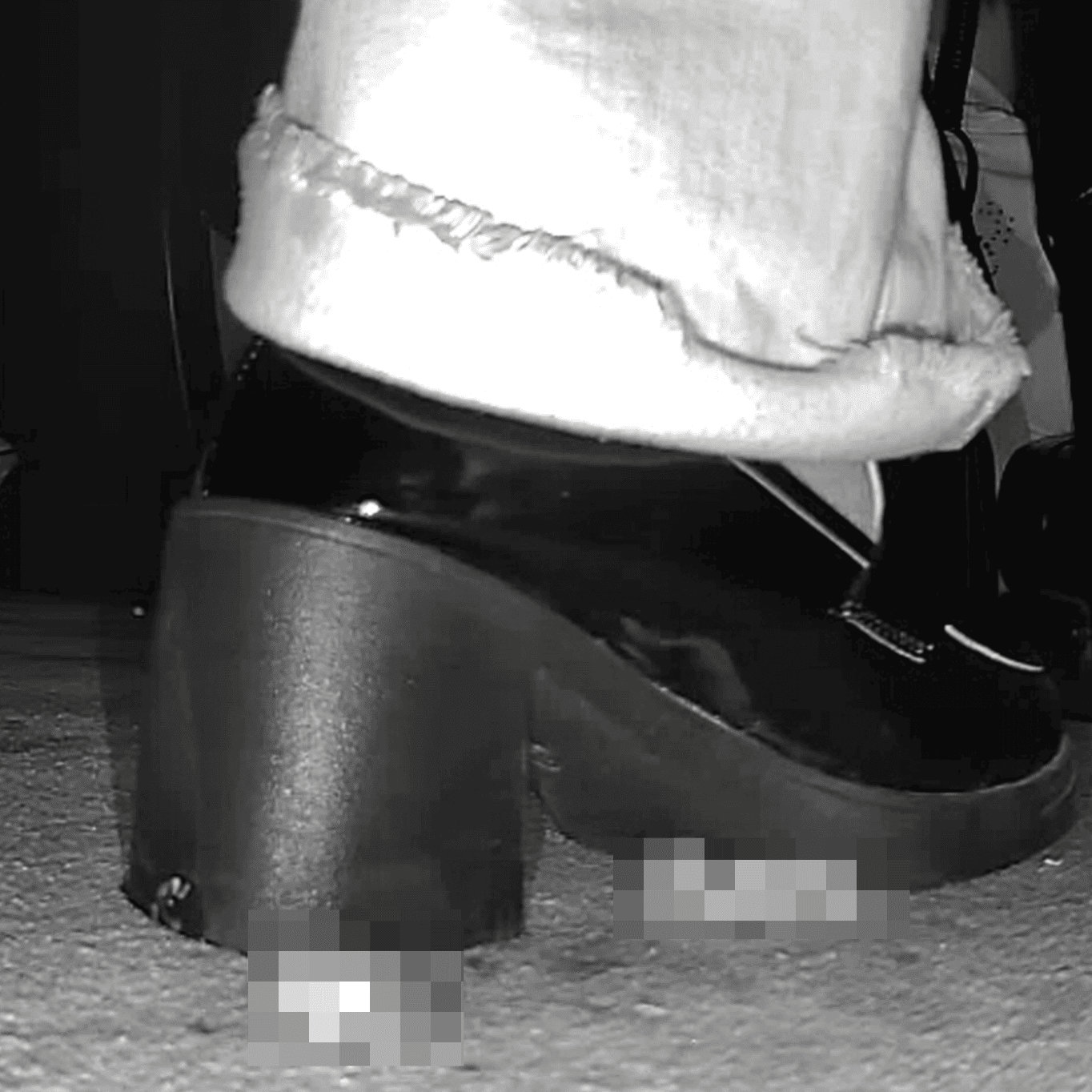 Woman with black chunky heeled shoes candid crush in movie theater