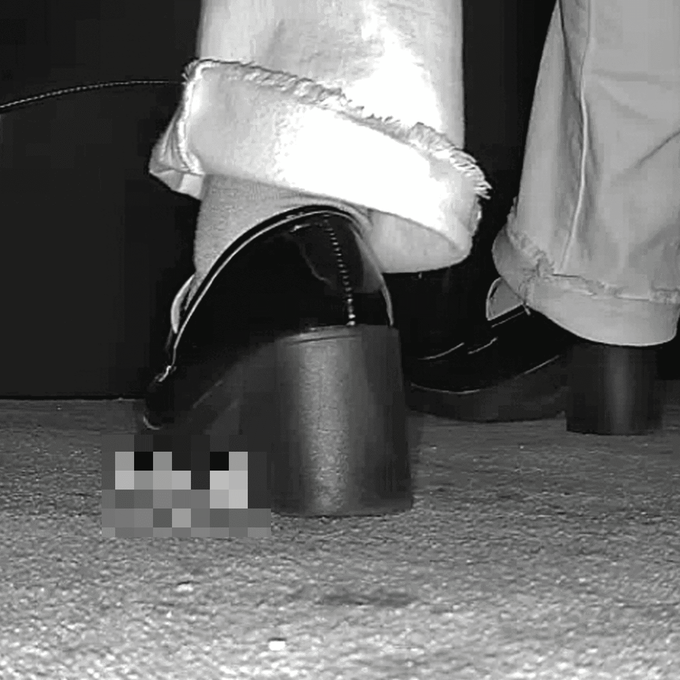 Woman with black chunky heeled shoes candid crush in movie theater