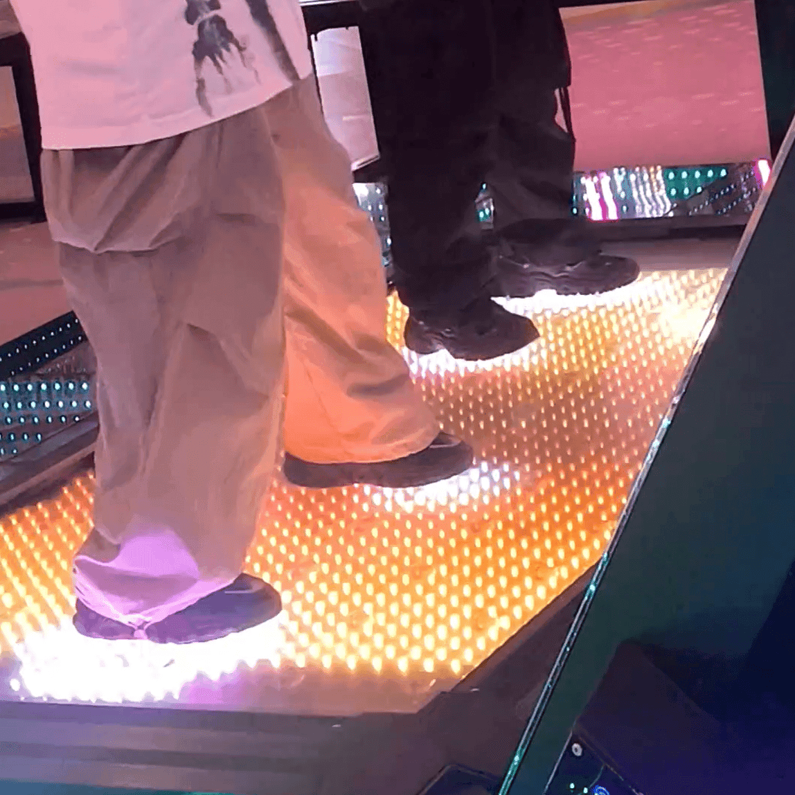 Two ladies in black sneakers candid crush on the dance machine
