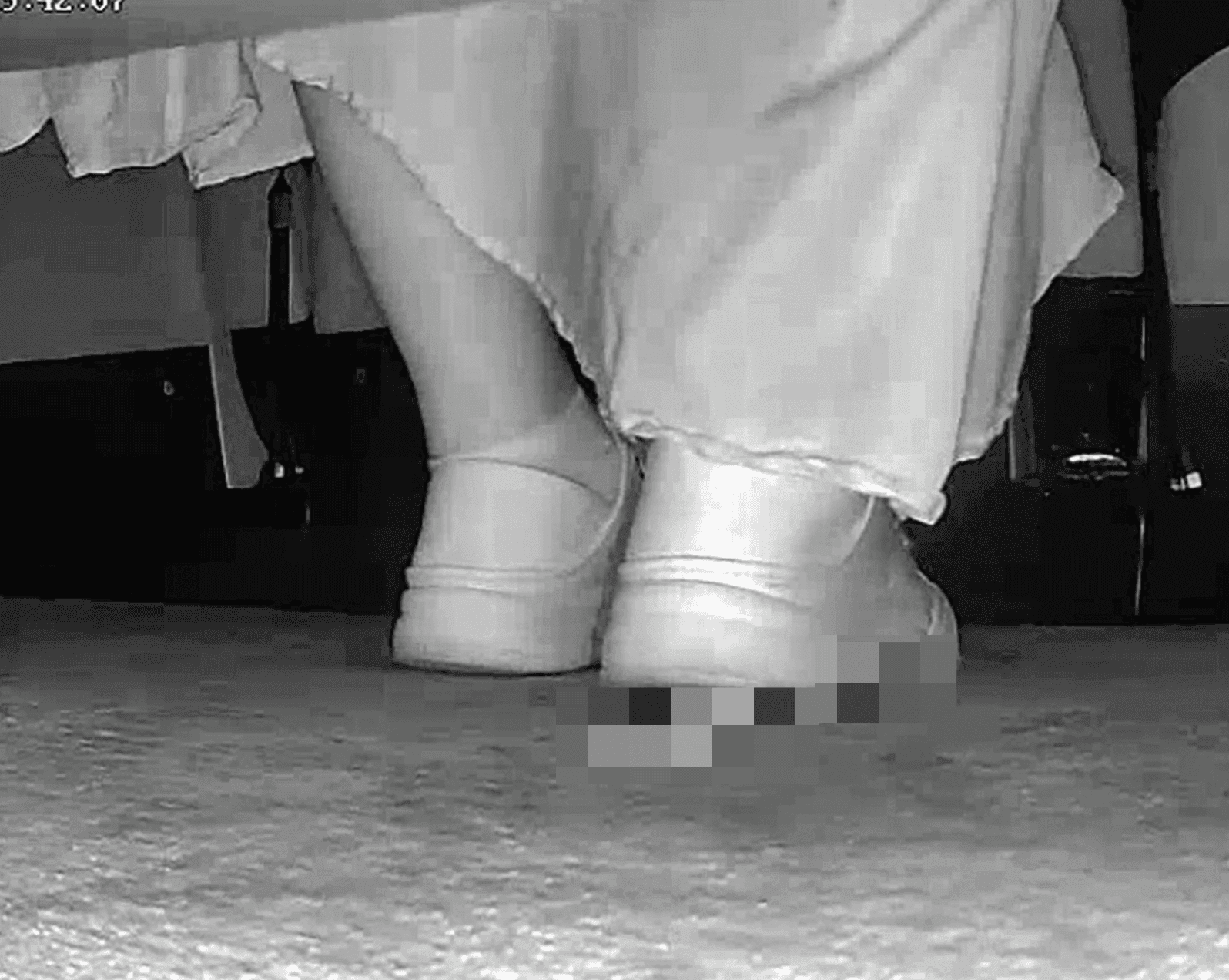 Woman in skirt and white sneakers candid crush in the cinema