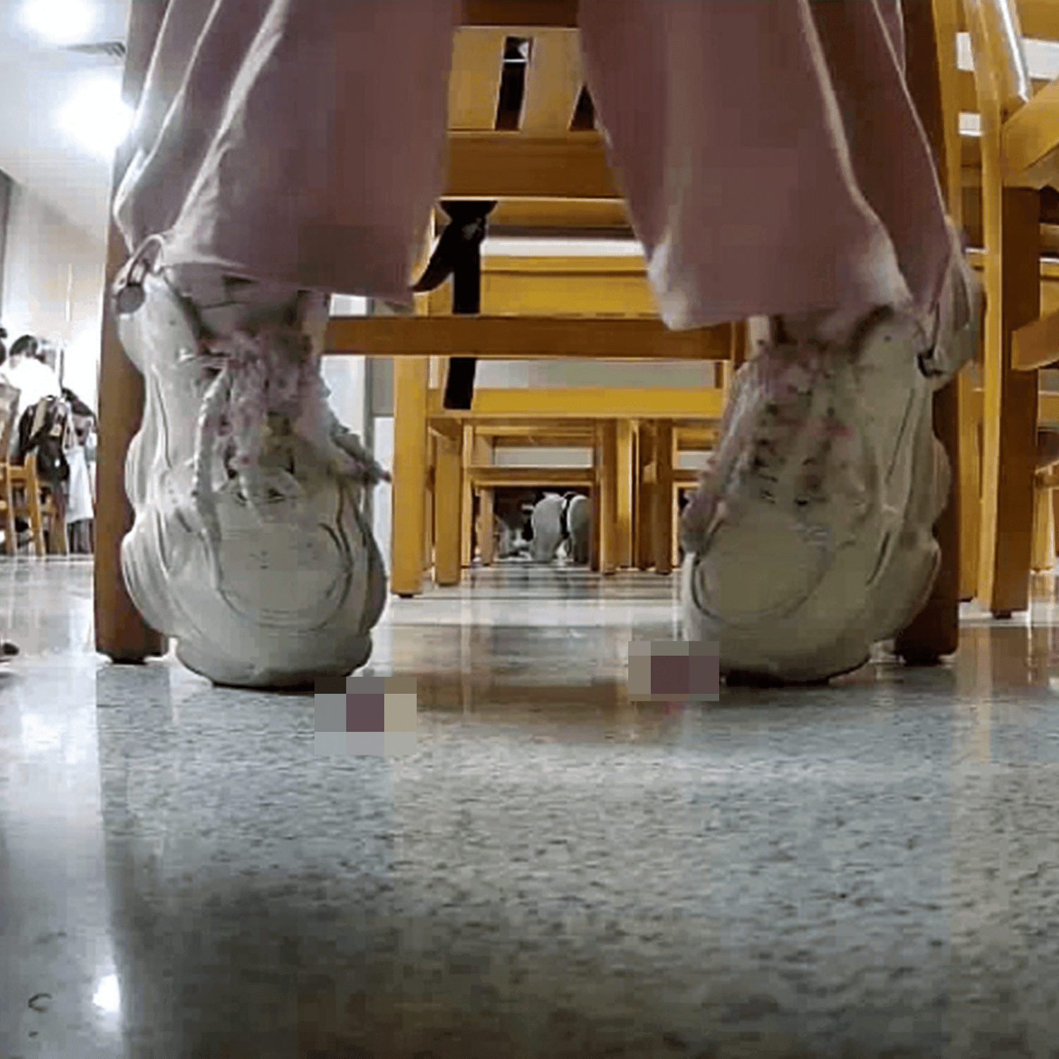 Woman in white sneaker candid crush under the library table