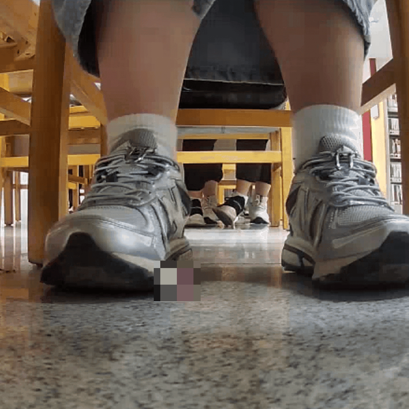 Woman in white socks and sneakers candid crush in library