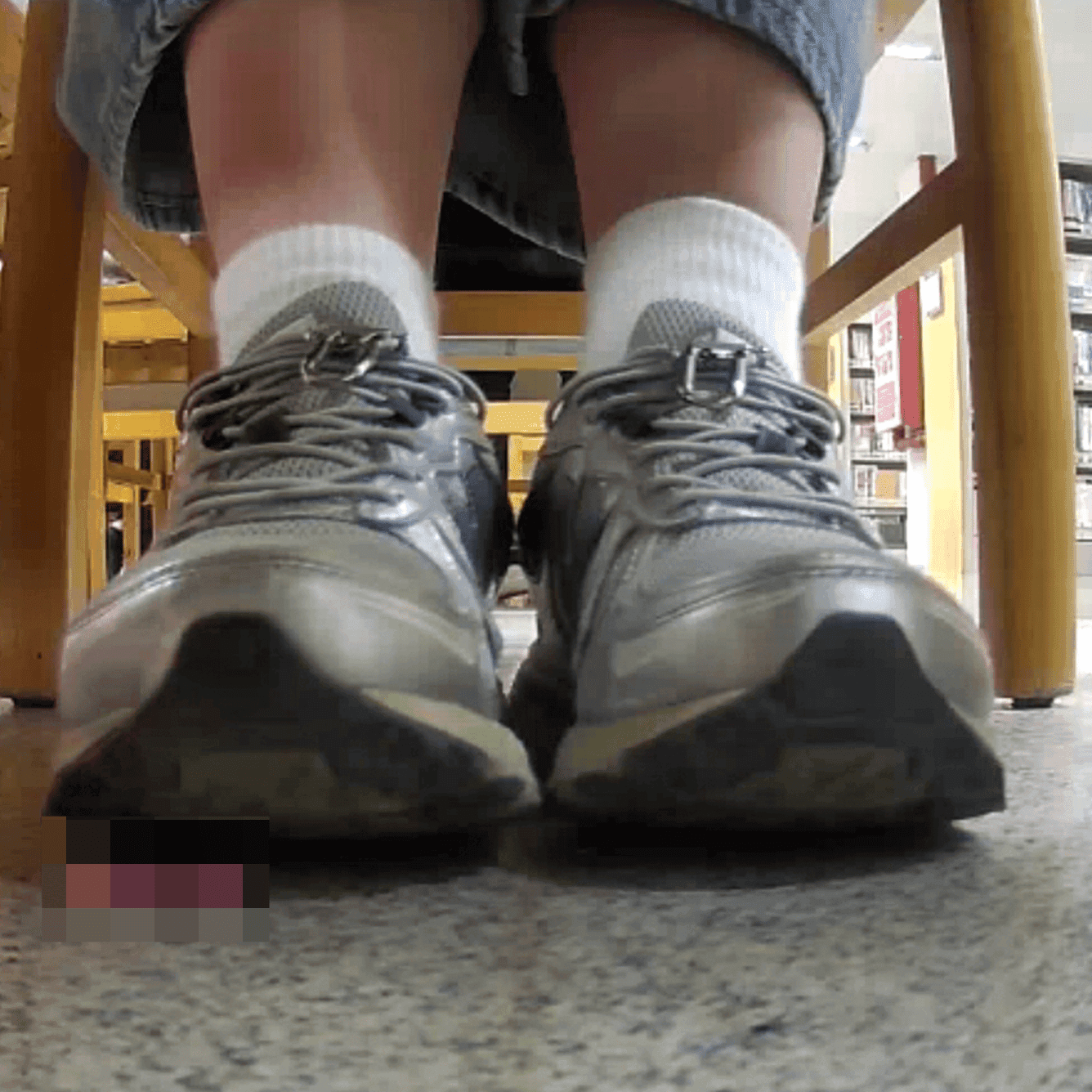 Woman in white socks and sneakers candid crush in library