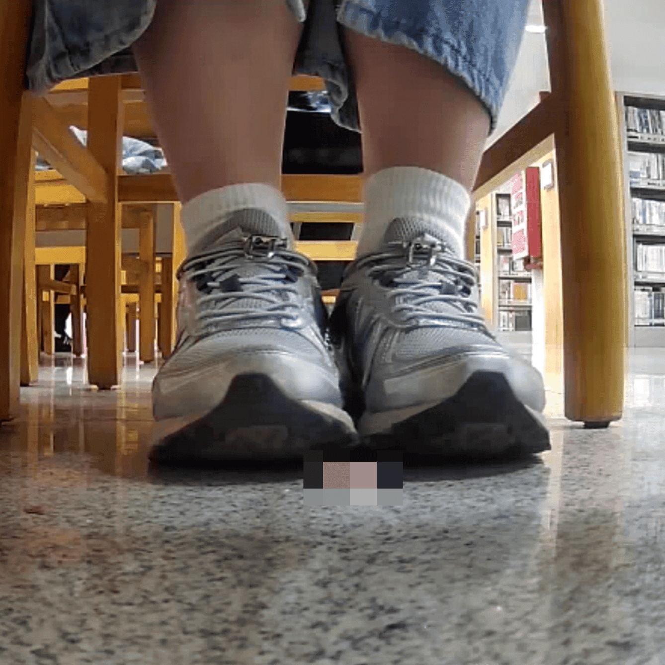 Woman in white socks and sneakers candid crush in library