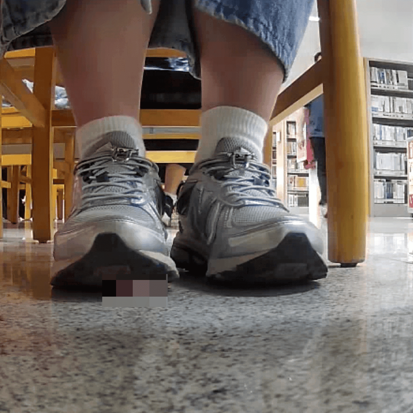 Woman in white socks and sneakers candid crush in library