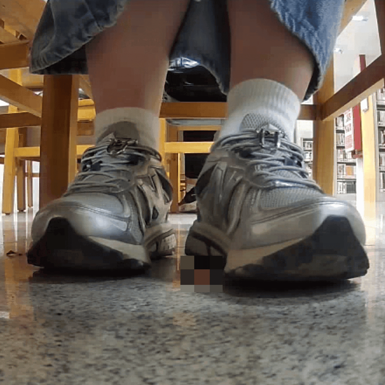Woman in white socks and sneakers candid crush in library