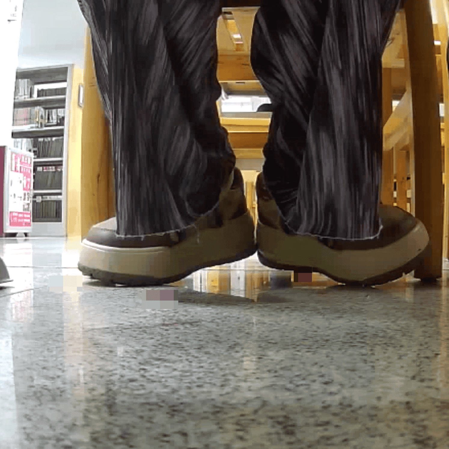 Woman at the library candid crush with the toe of her sneaker
