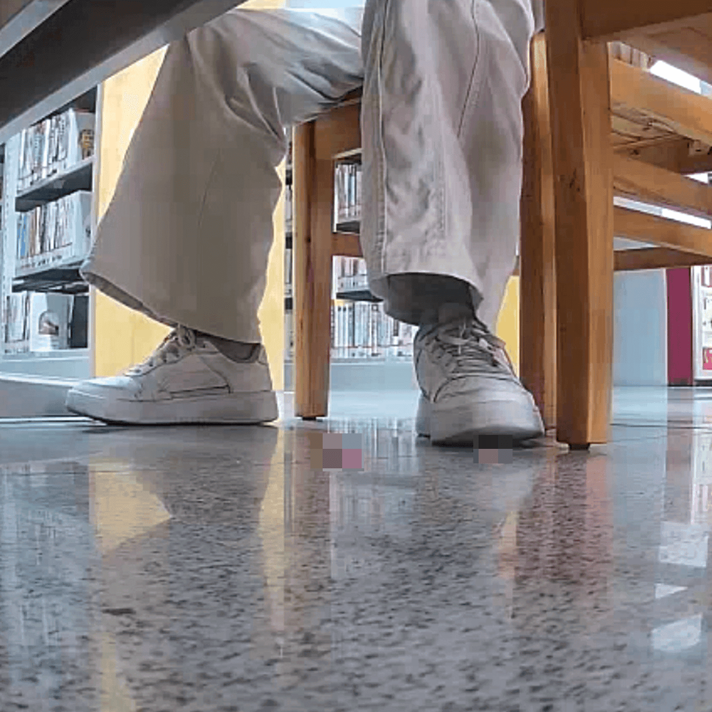 Woman candid crush with white sneakers at the library