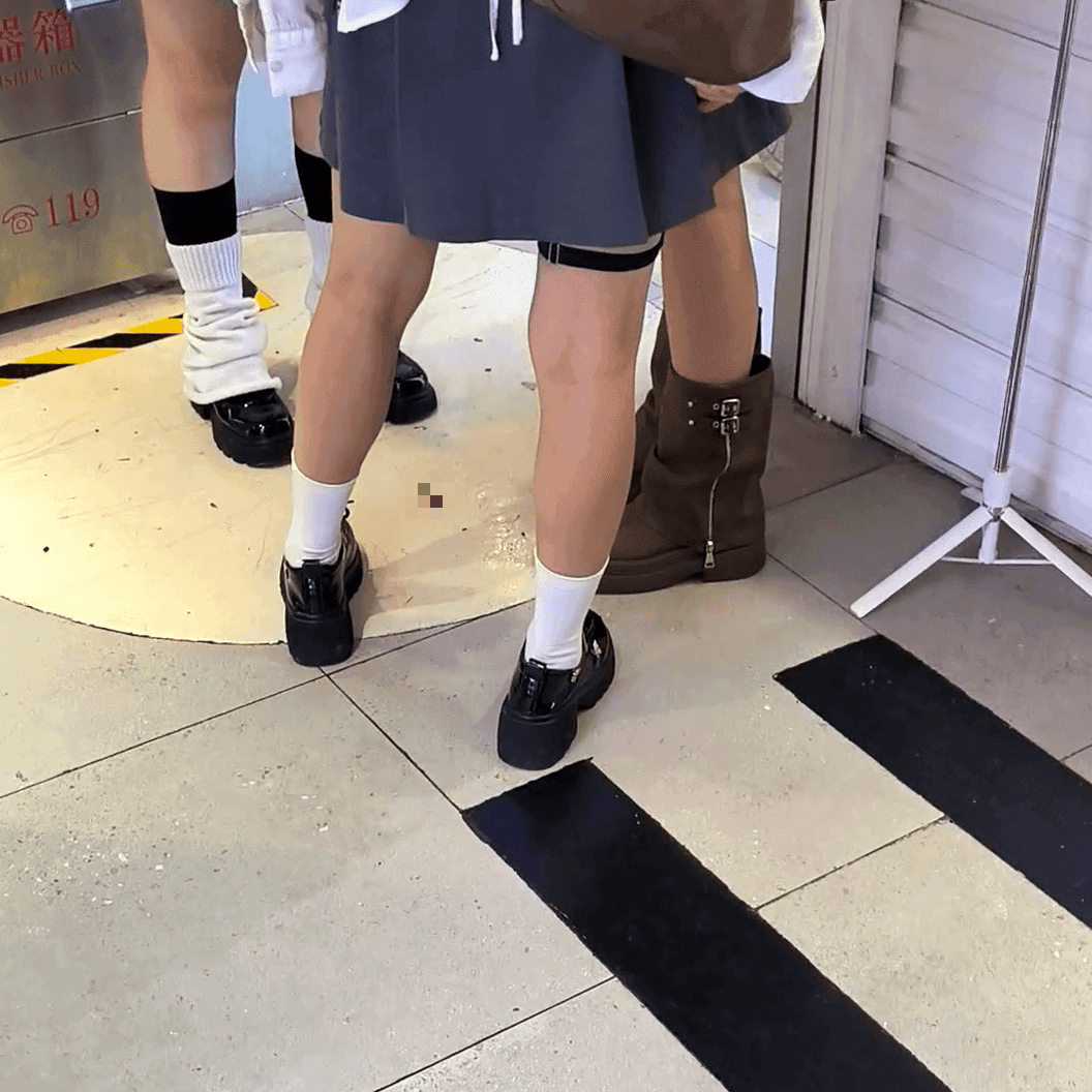 Anime convention cosplay woman in white stockings and leather shoes candid crush