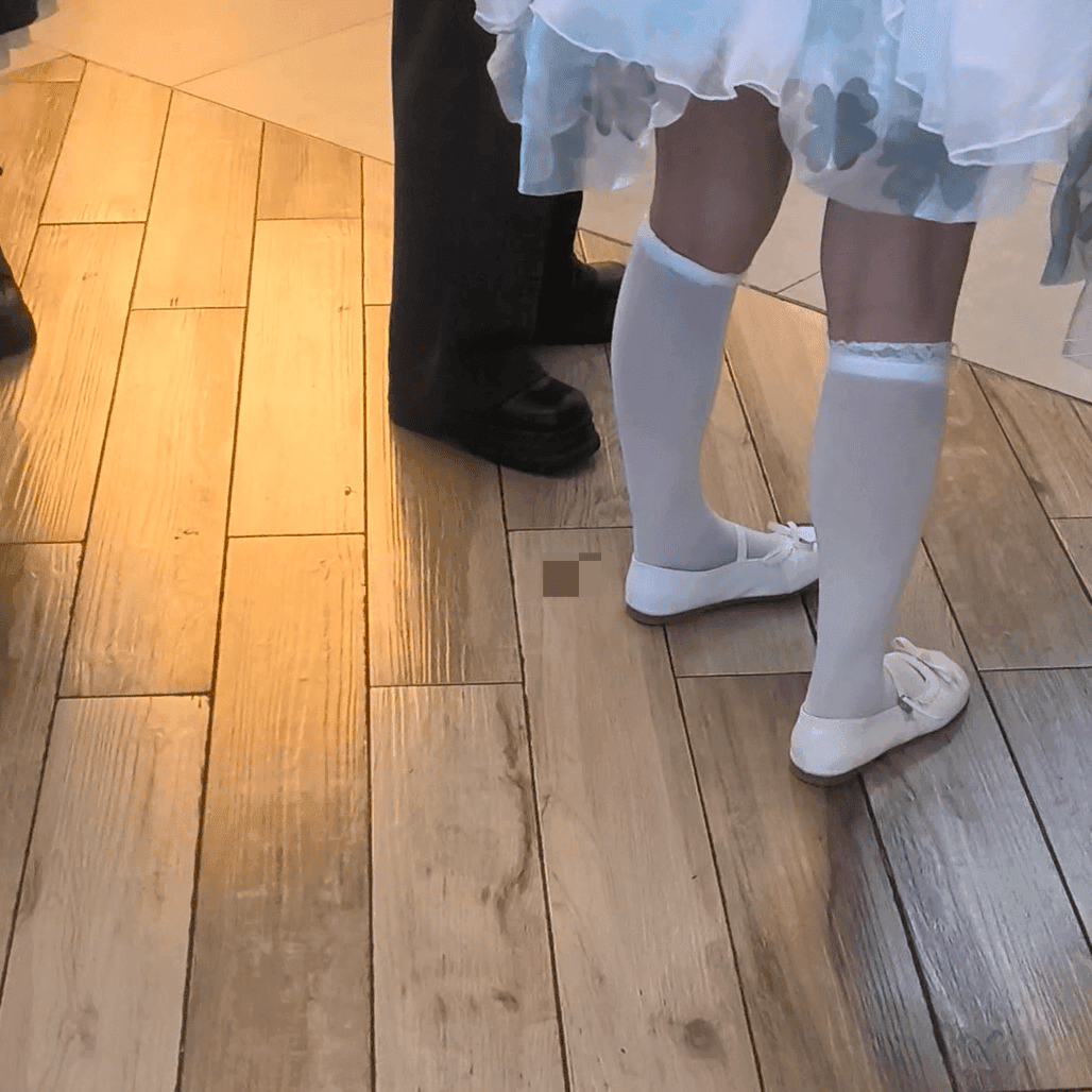 Anime convention cosplay woman in white stockings and leather shoes candid crush