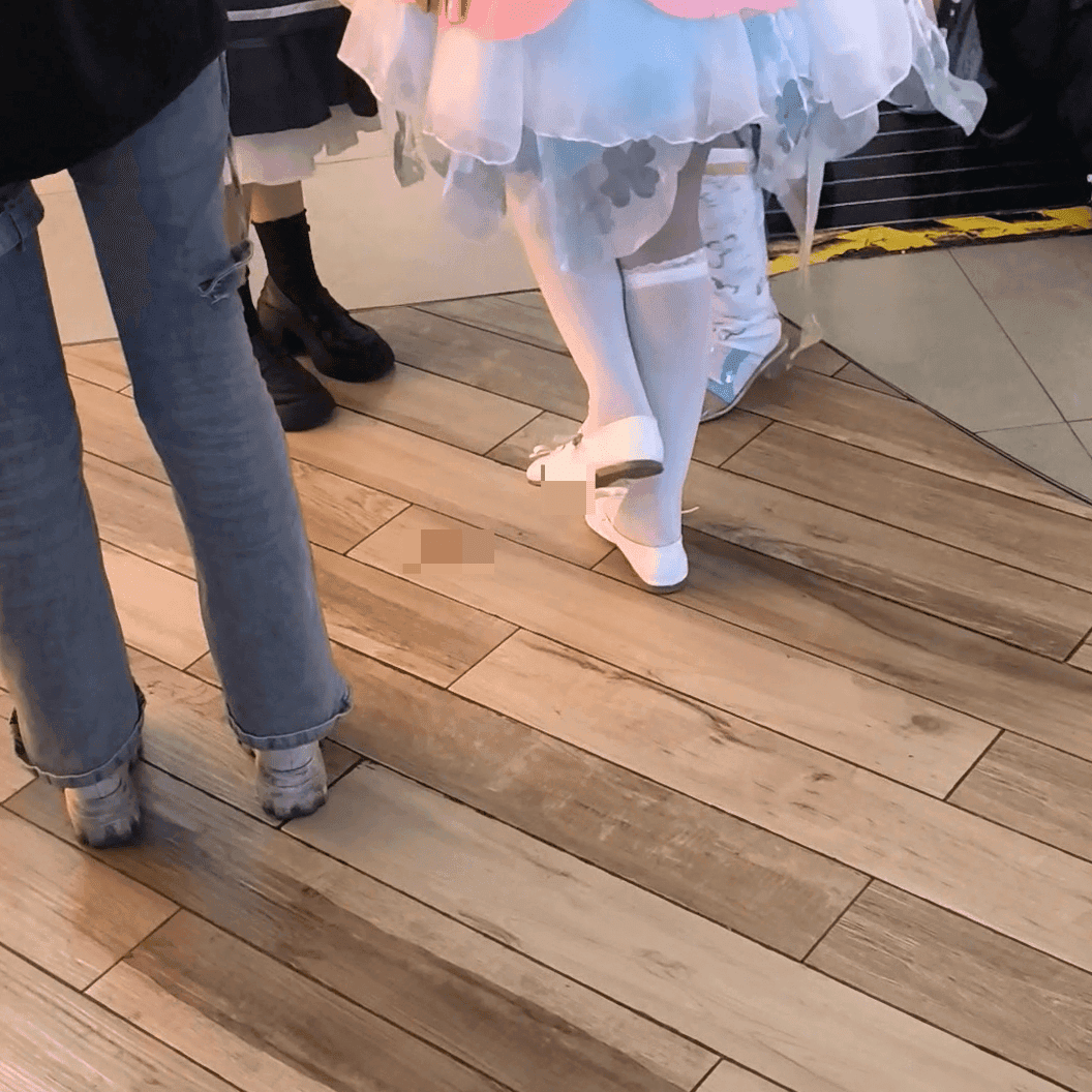 Anime convention cosplay woman in white stockings and leather shoes candid crush