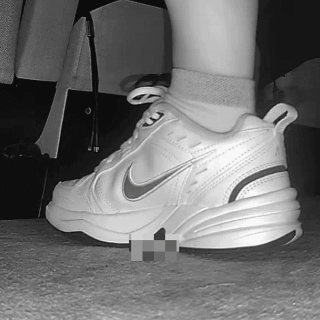 Woman in Nike Air sneakers candid crush at the cinema