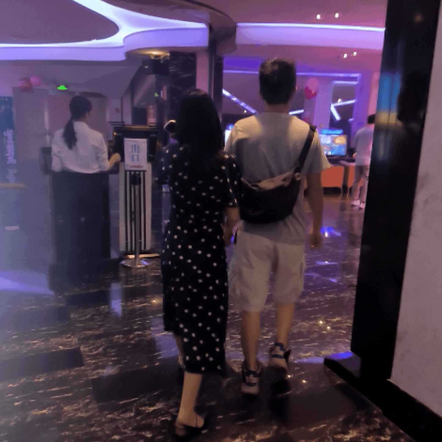 Cinema girl candid stepping on hand with black leather shoes + flat sandals