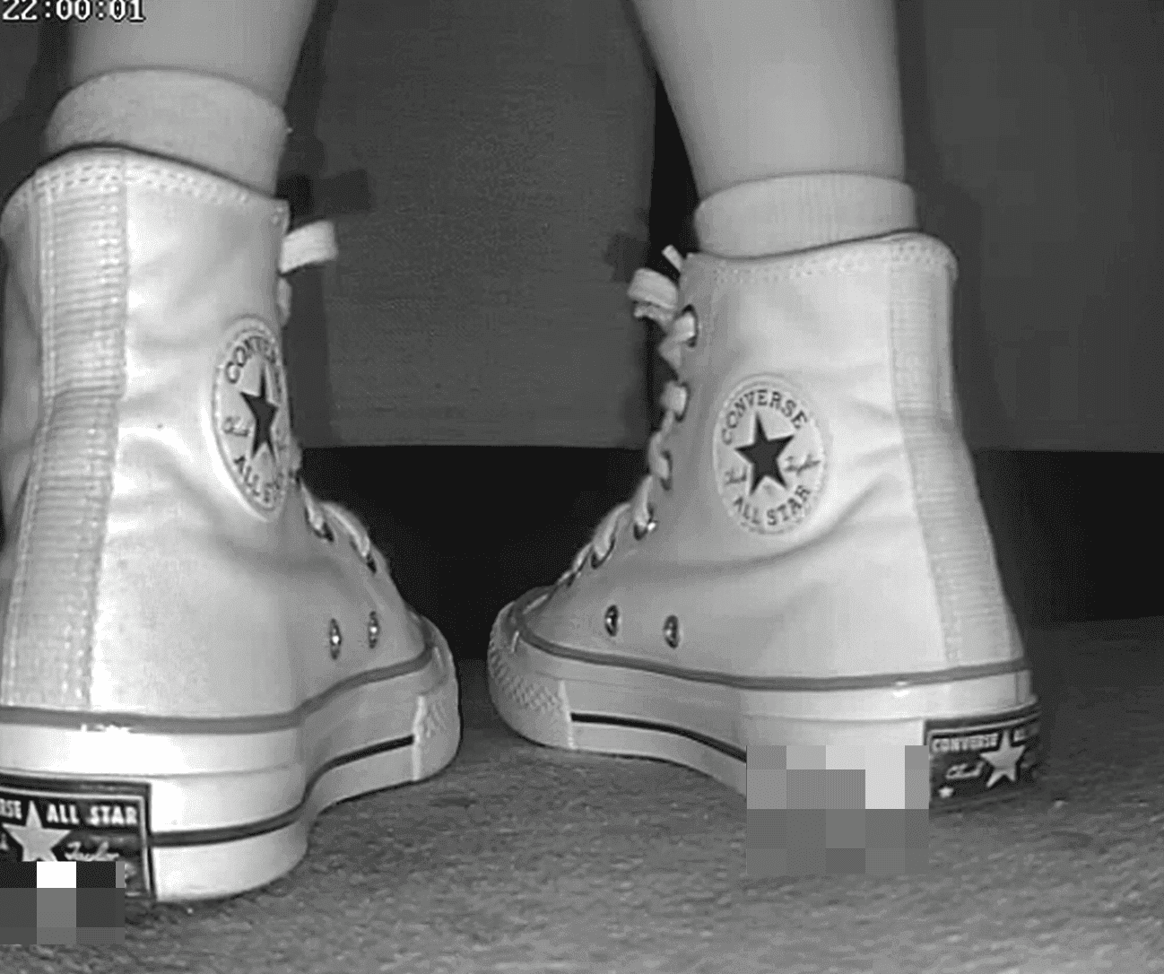 Woman candid crush with high-top white Converse at cinema