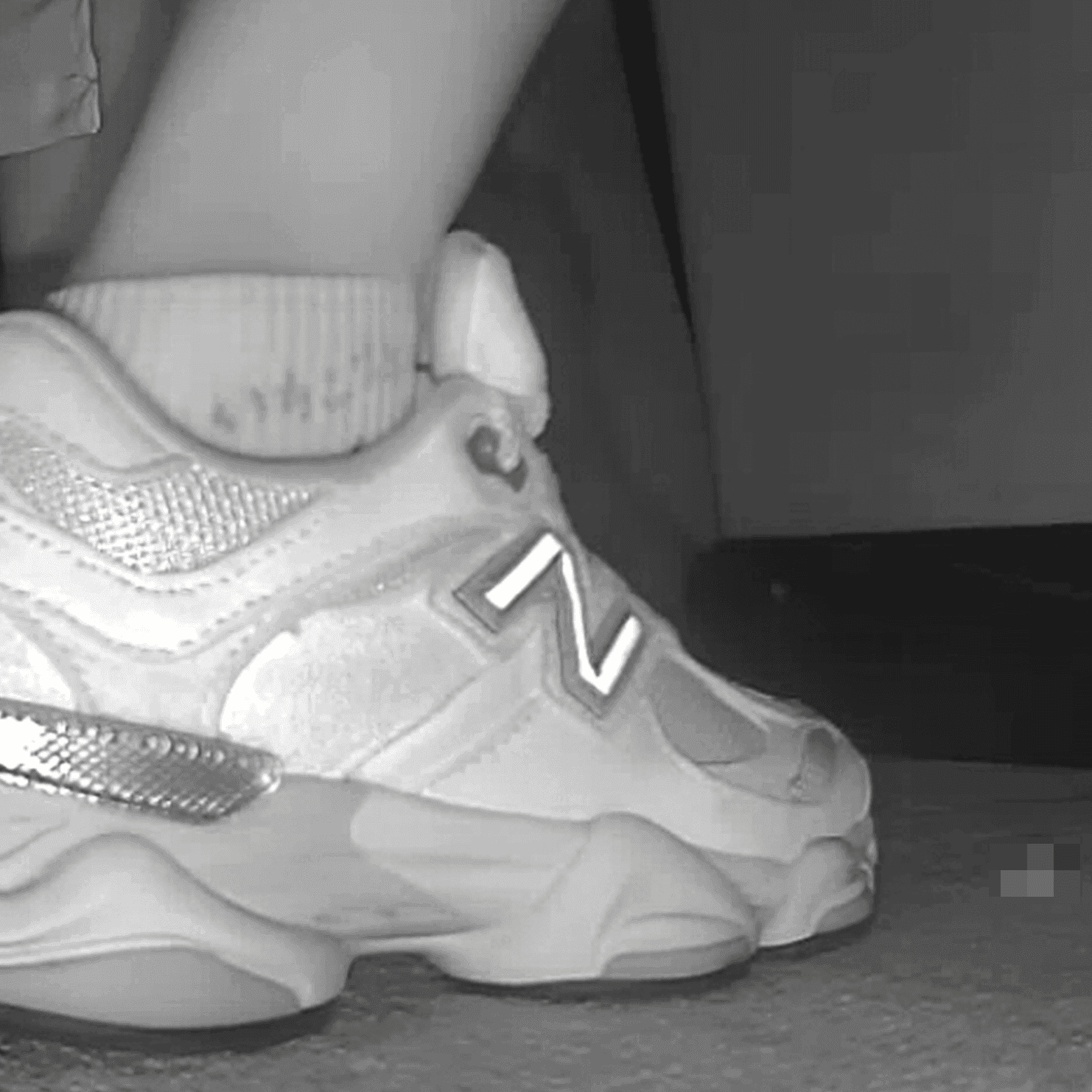 Woman sitting with her boyfriend candid crush with New Balance sneakers at cinema