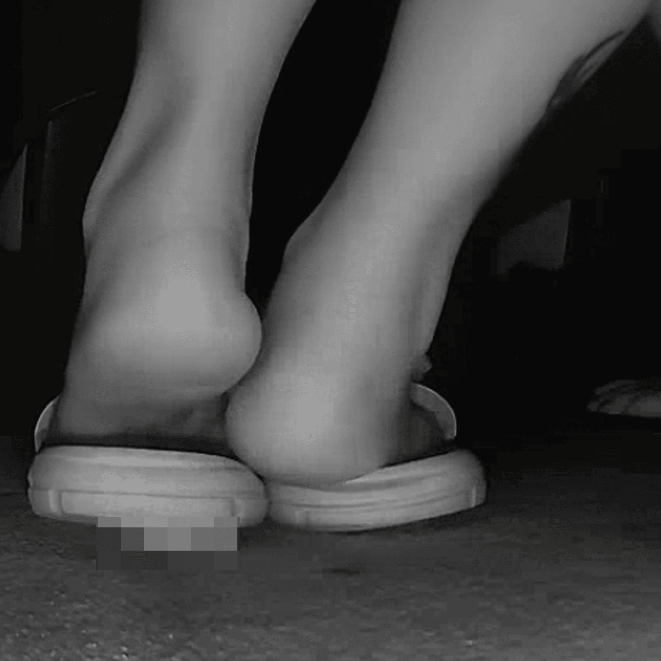 Woman in slippers shaking her leg candid crush at the cinema