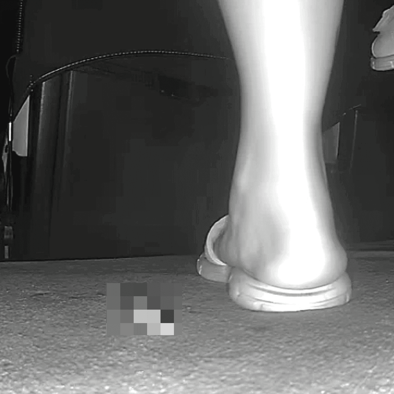 Woman in slippers shaking her leg candid crush at the cinema