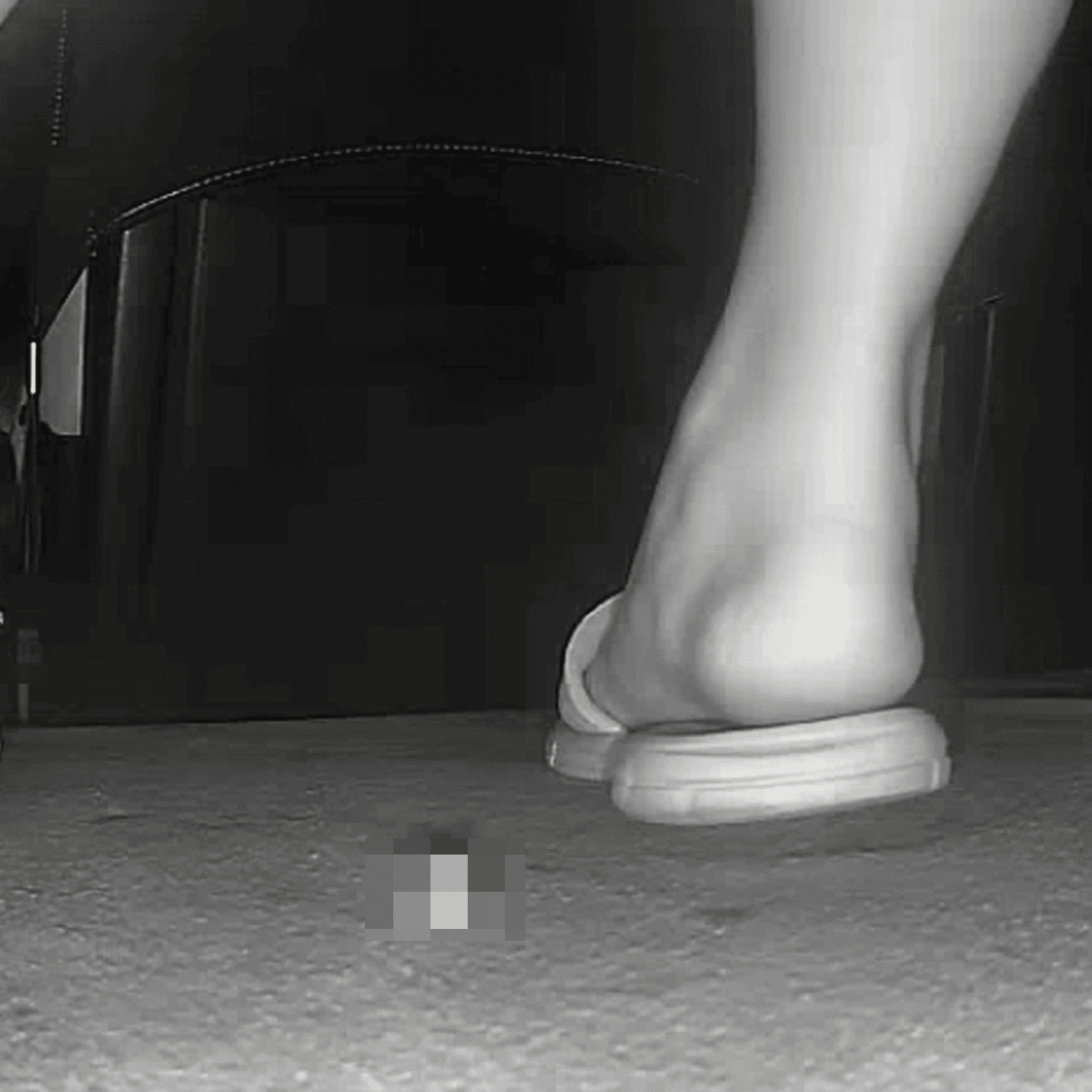 Woman in slippers shaking her leg candid crush at the cinema