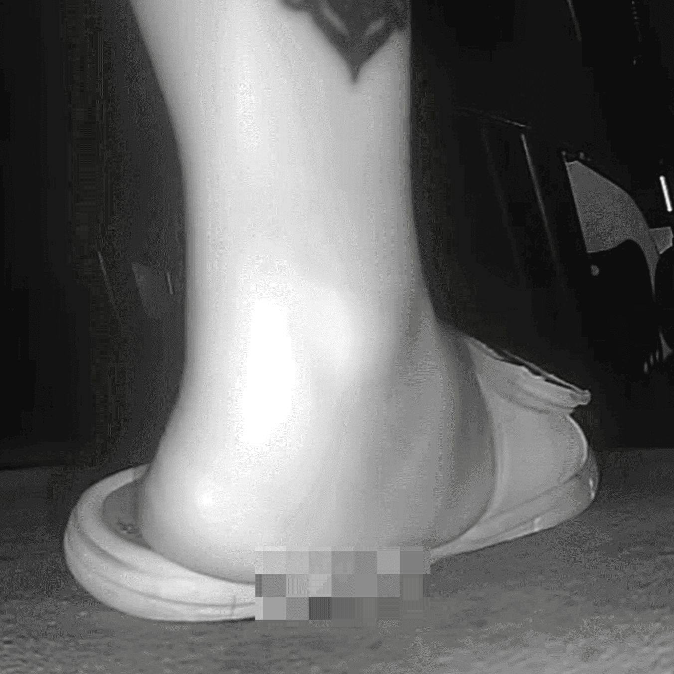 Woman in slippers shaking her leg candid crush at the cinema