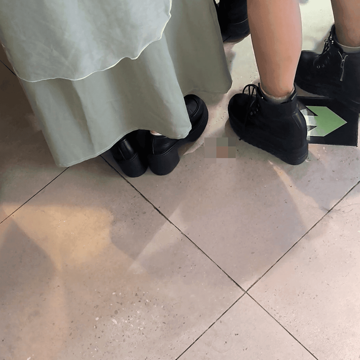Game arcade woman candid crush with chunky heeled leather shoes and Martin boots