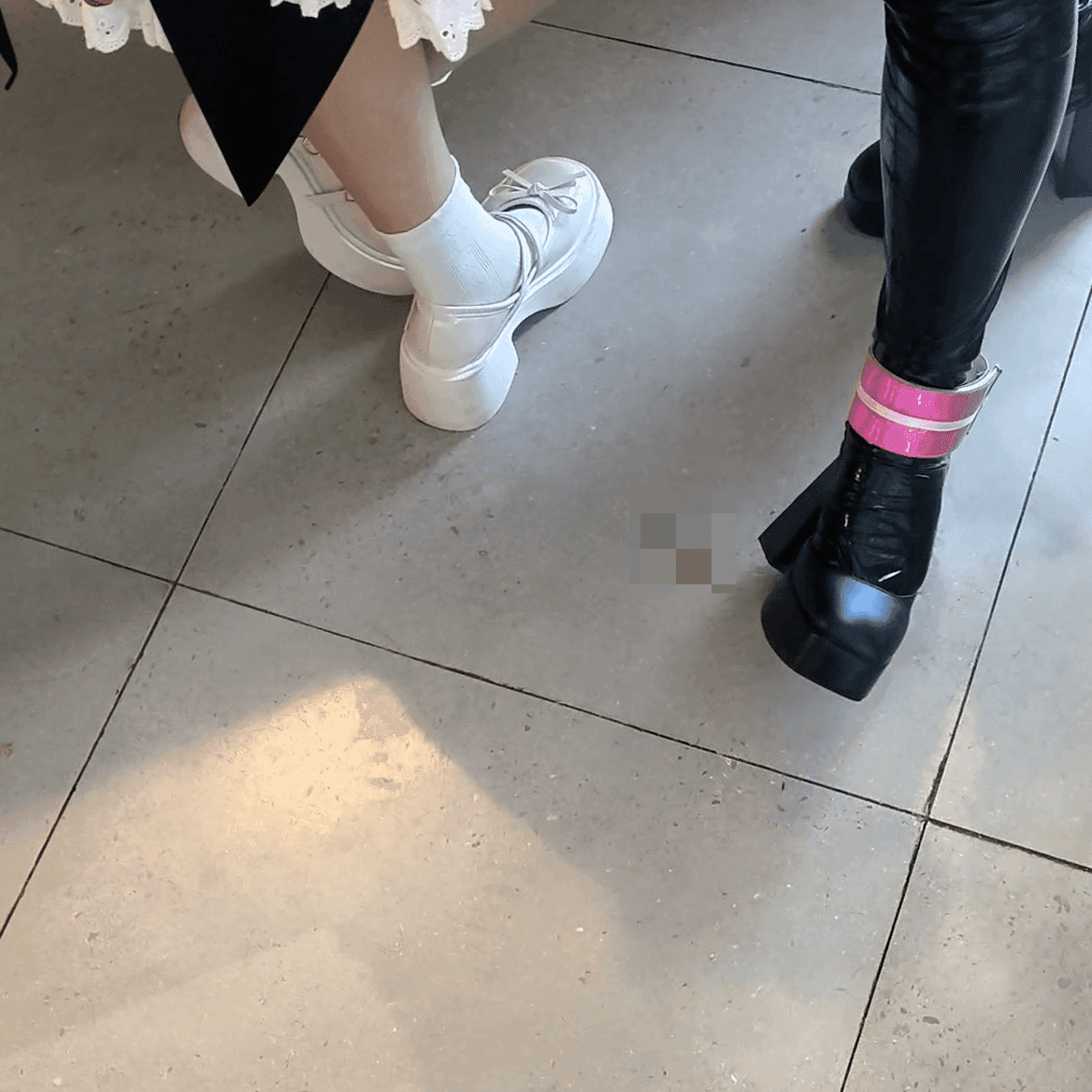 Game arcade woman candid crush with chunky heeled leather shoes and Martin boots