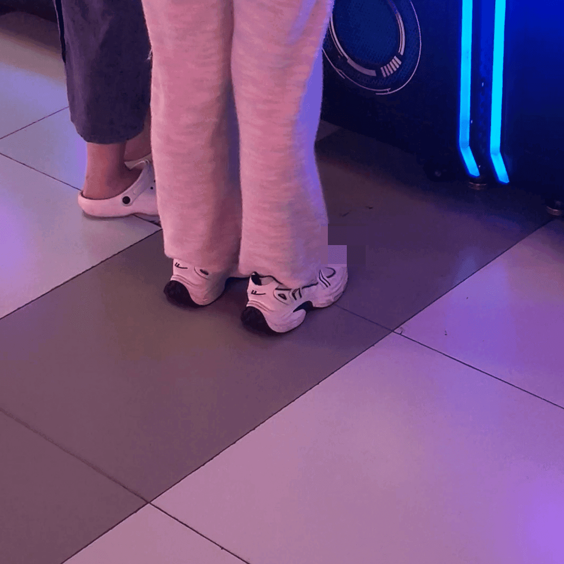 Game arcade dance machine and basketball shooting game woman candid crush with sneakers