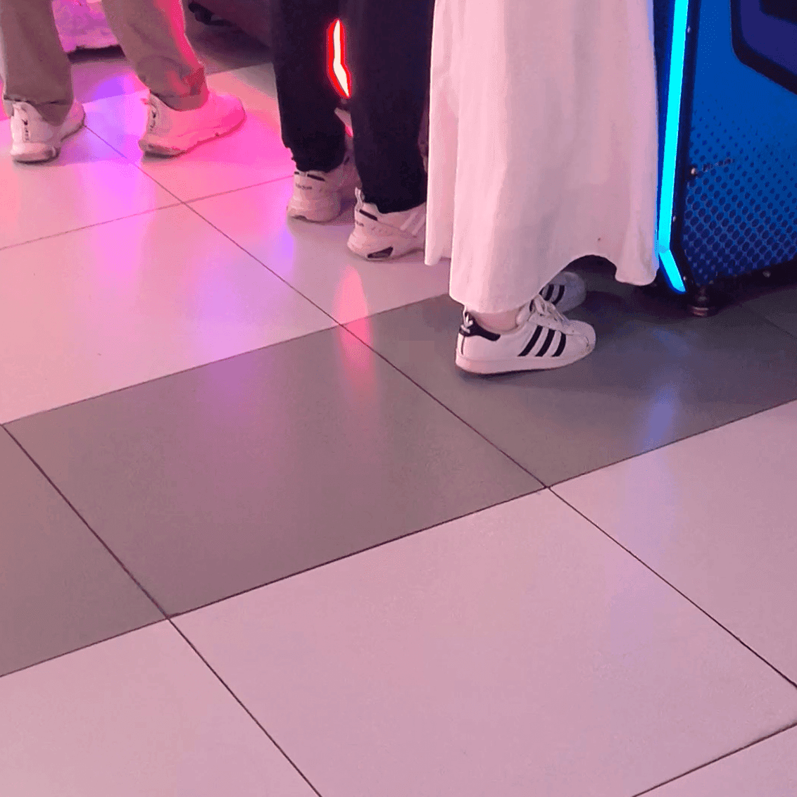 Game arcade dance machine and basketball shooting game woman candid crush with sneakers