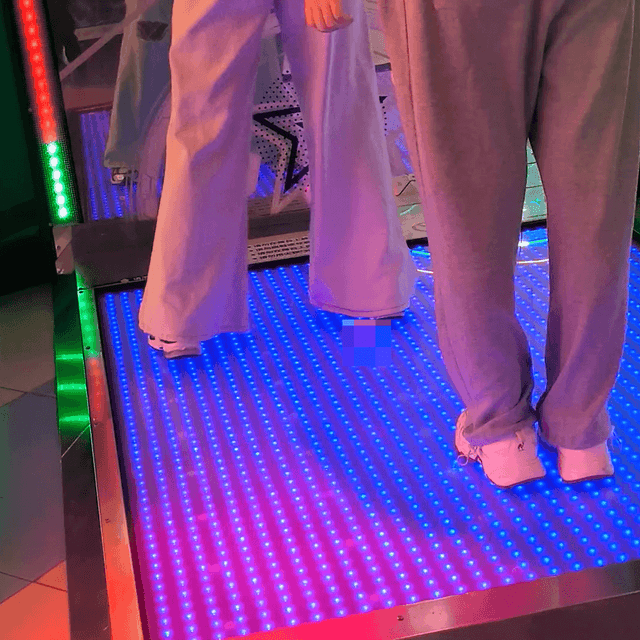Game arcade dance machine and basketball shooting game woman candid crush with sneakers