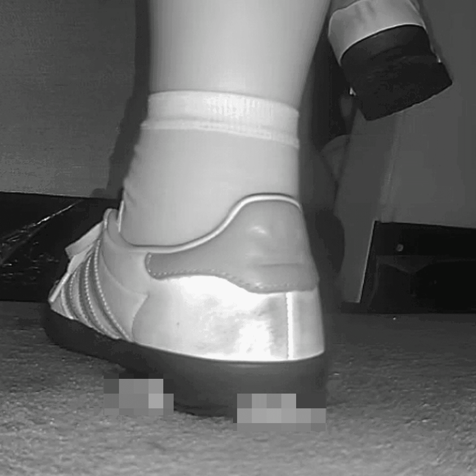 Woman in cinema candid crush with Adidas Samba sneakers