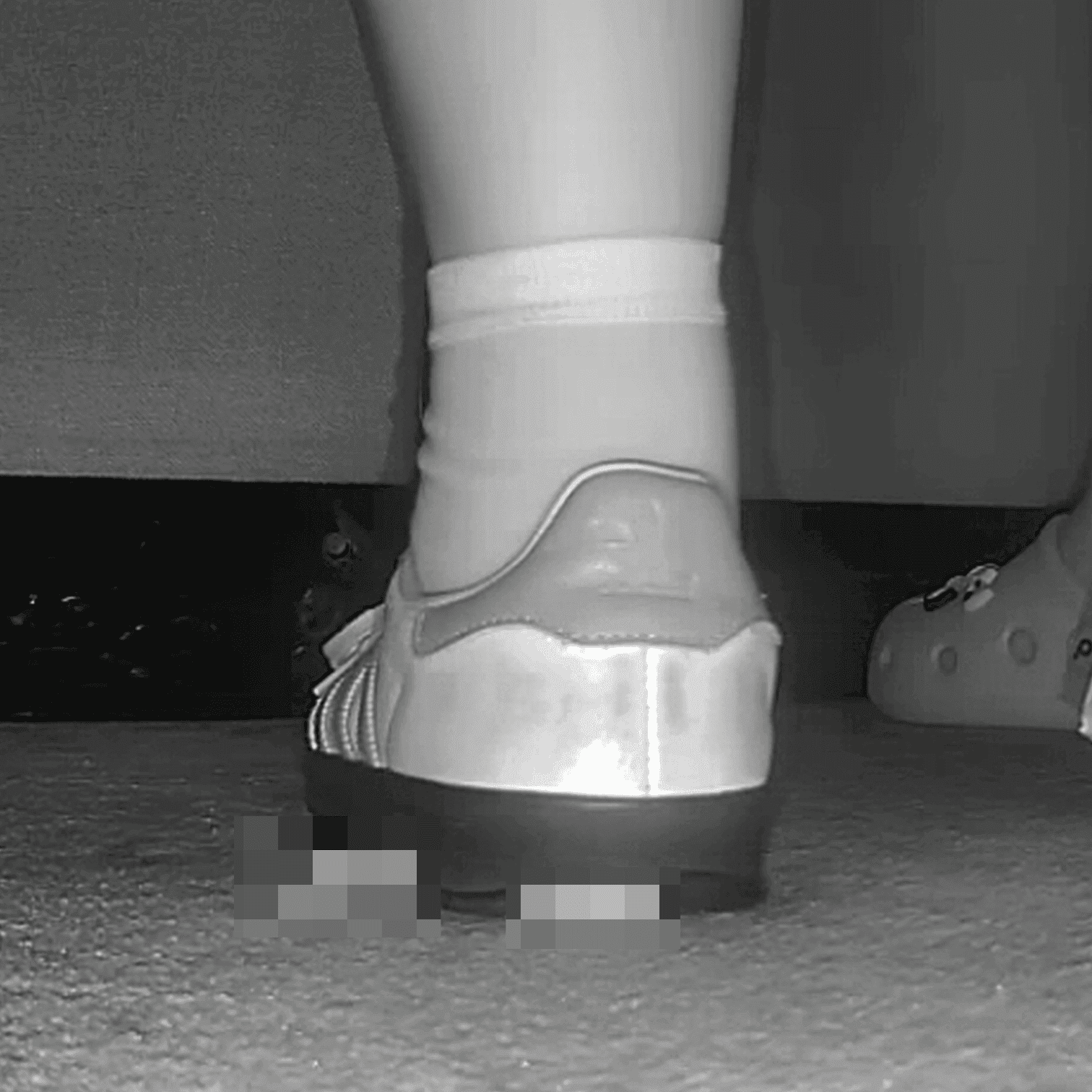Woman in cinema candid crush with Adidas Samba sneakers
