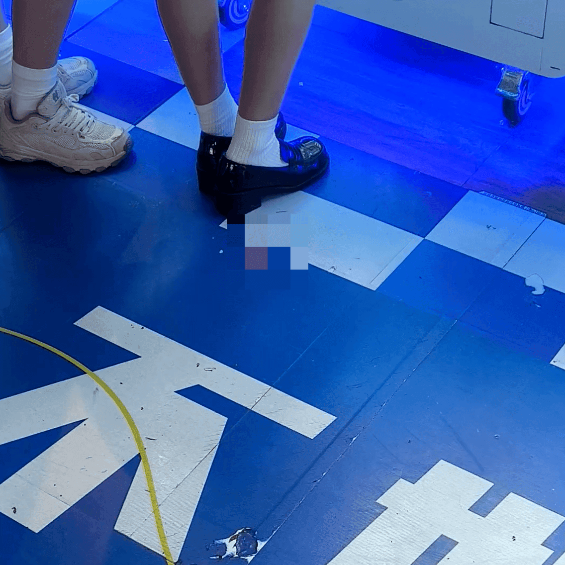 Game arcade woman in a dress candid crush with leather shoes + flats and stuck to soles