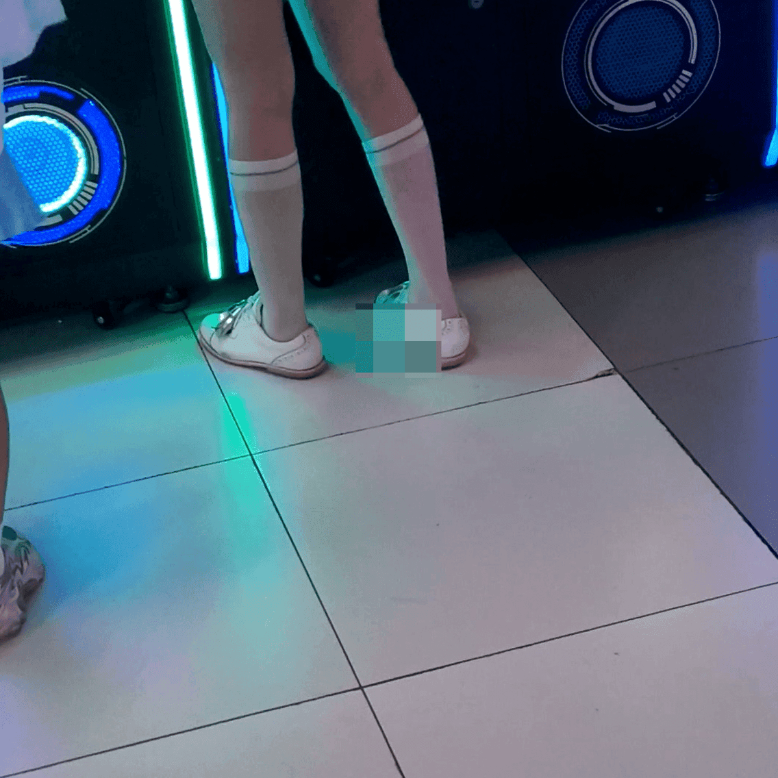 Game arcade woman in a dress candid crush with leather shoes + flats and stuck to soles