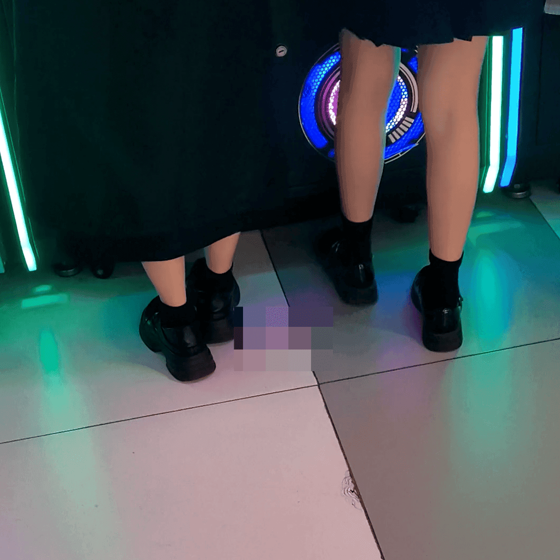Game arcade woman in a dress candid crush with leather shoes + flats and stuck to soles