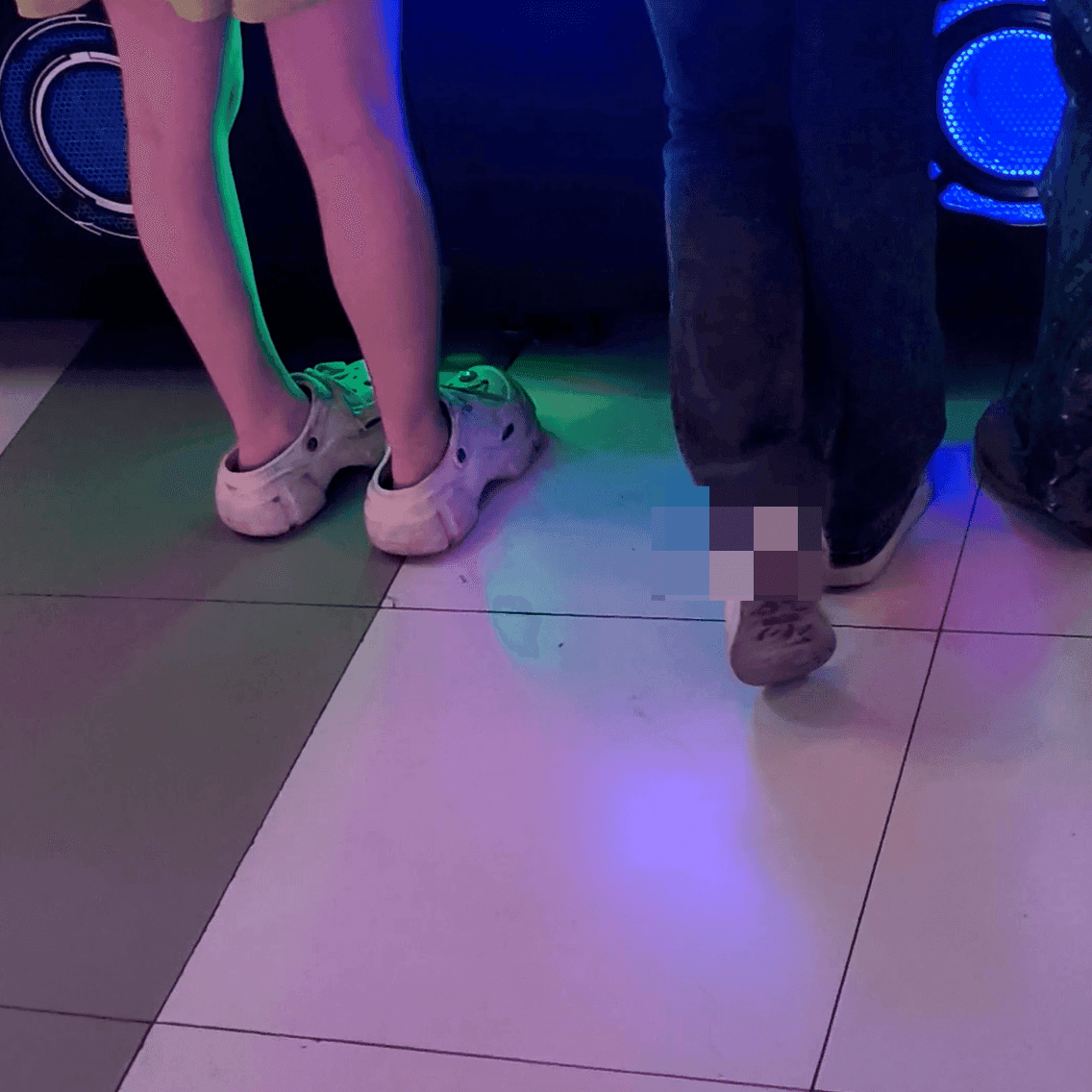 Game arcade woman in a dress candid crush with leather shoes + flats and stuck to soles