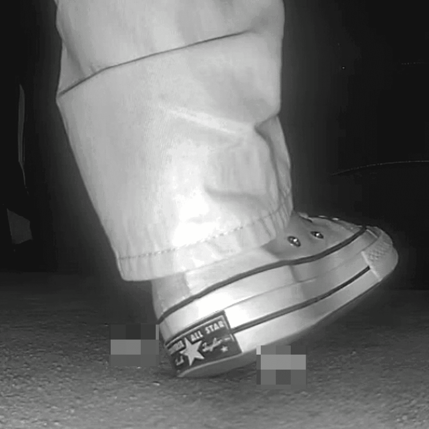 Woman in high-top Converse canvas shoes candid crush at the cinema