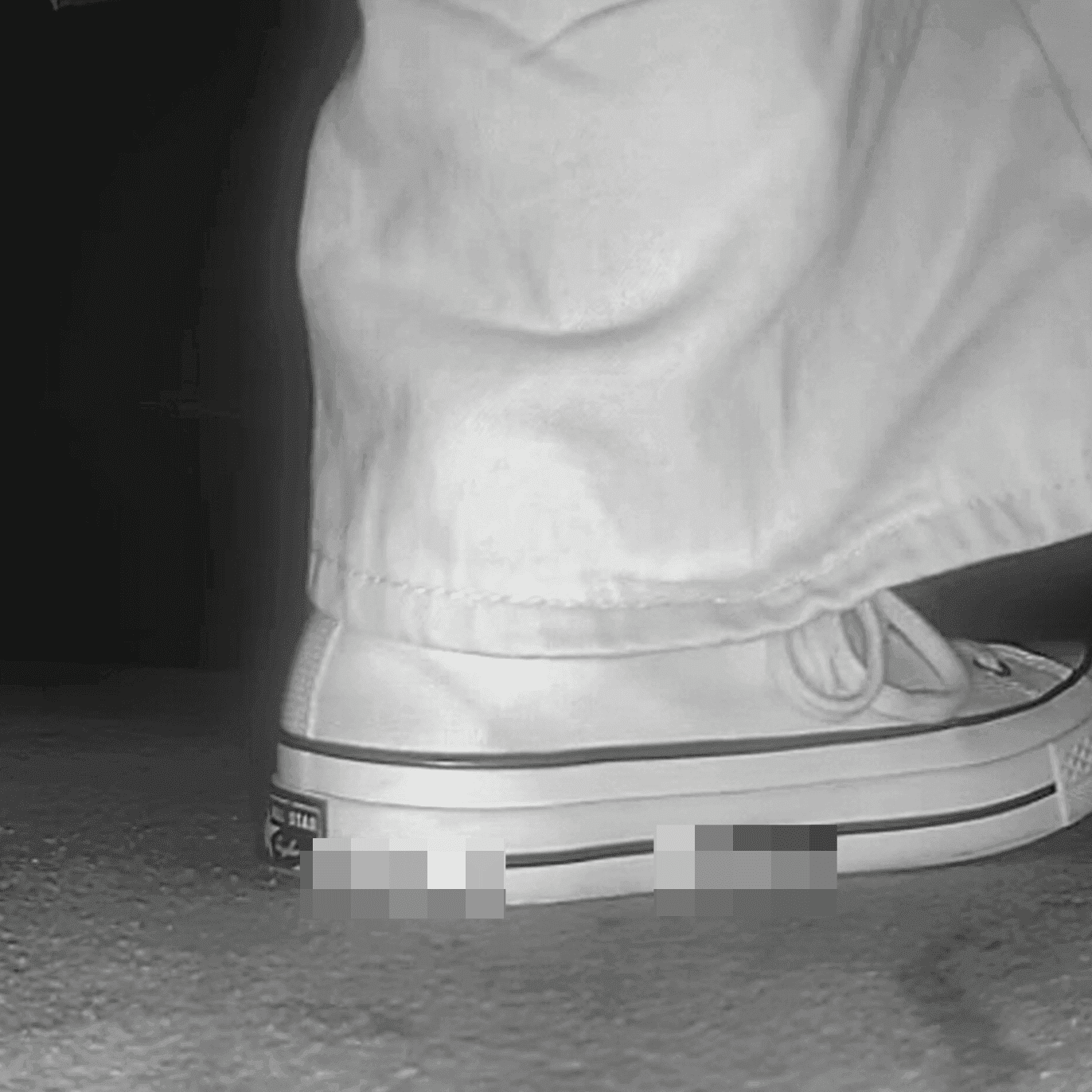 Woman in high-top Converse canvas shoes candid crush at the cinema