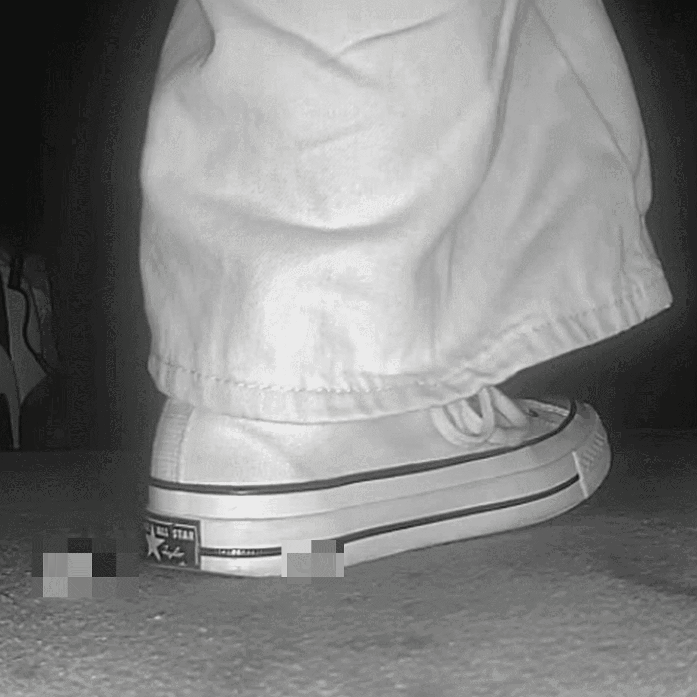 Woman in high-top Converse canvas shoes candid crush at the cinema