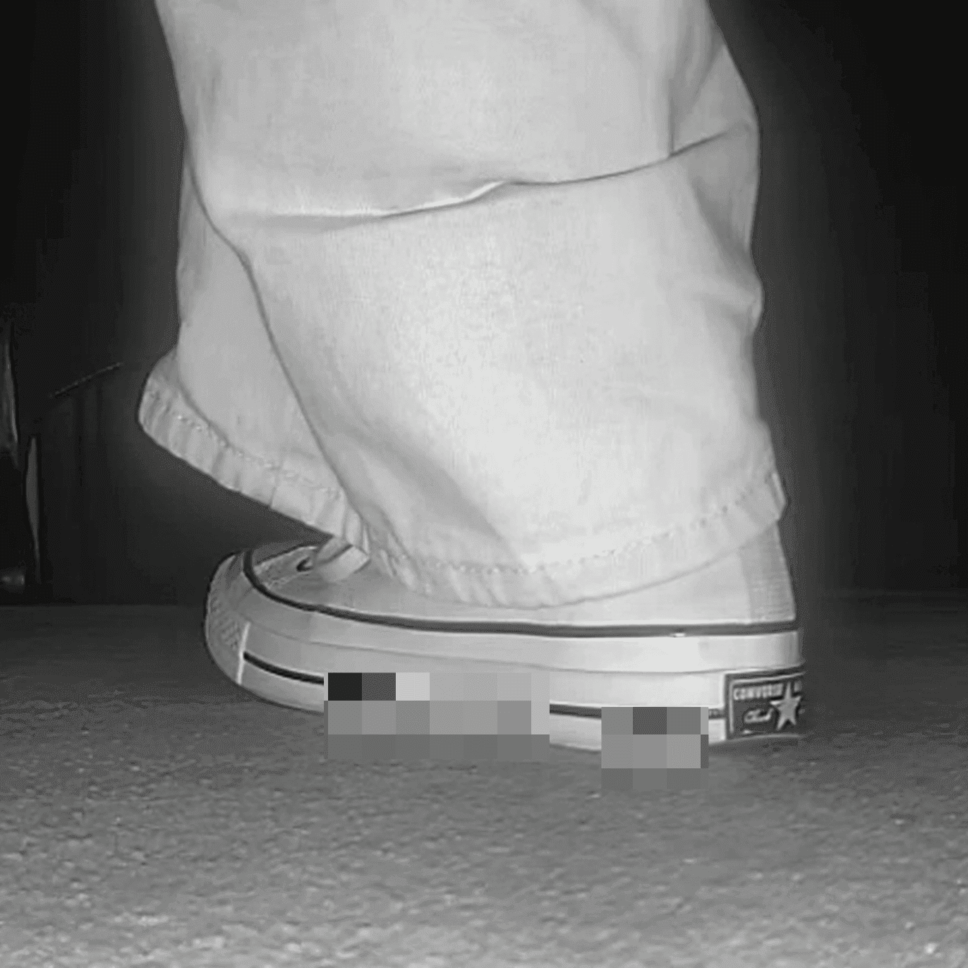 Woman in high-top Converse canvas shoes candid crush at the cinema