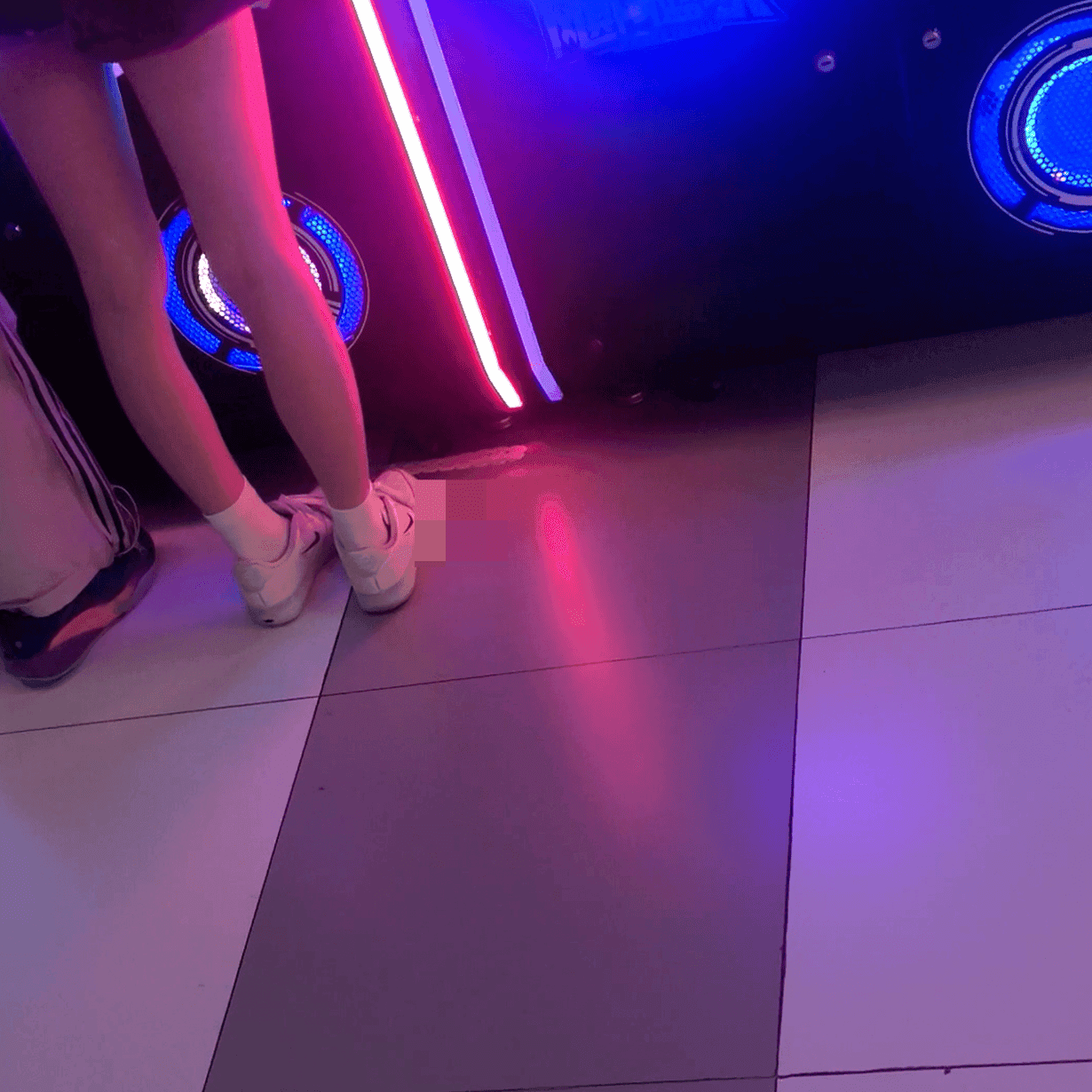Game arcade woman repeatedly candid crush with sneakers and leather shoes while playing the basketball shooting game