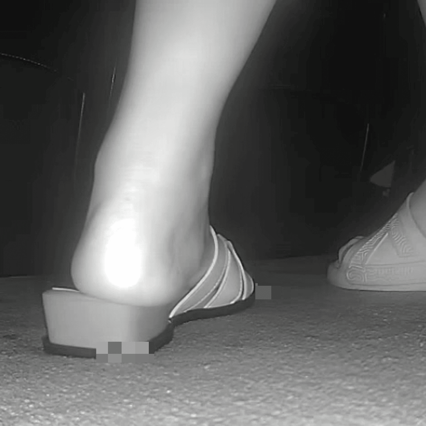 Woman candid crush with sandals in the cinema