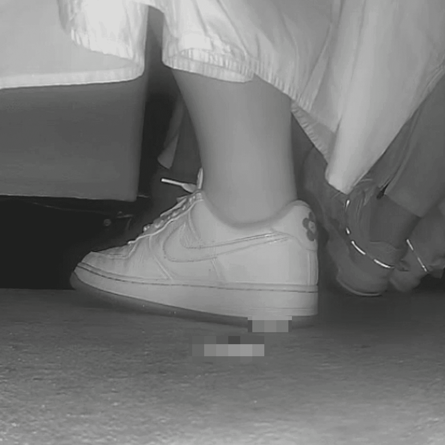 Woman in long dress candid crush with Nike sneakers at the cinema
