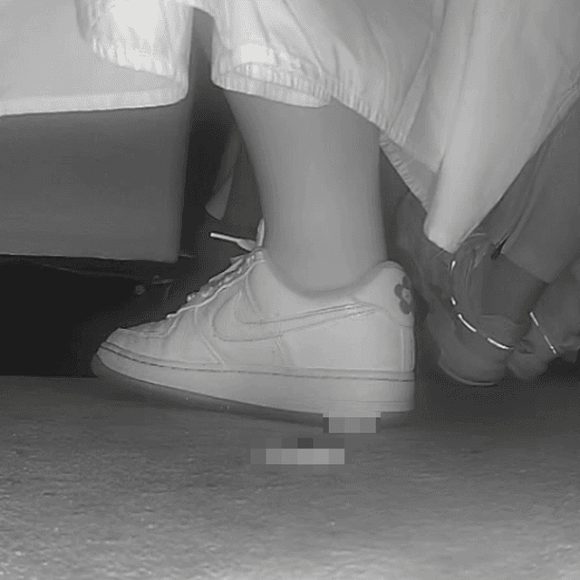Woman in long dress candid crush with Nike sneakers at the cinema