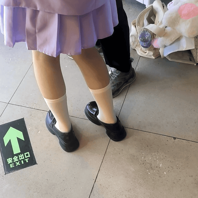 Anime convention cosplay girl in multiple pairs of leather shoes and boots candid crush
