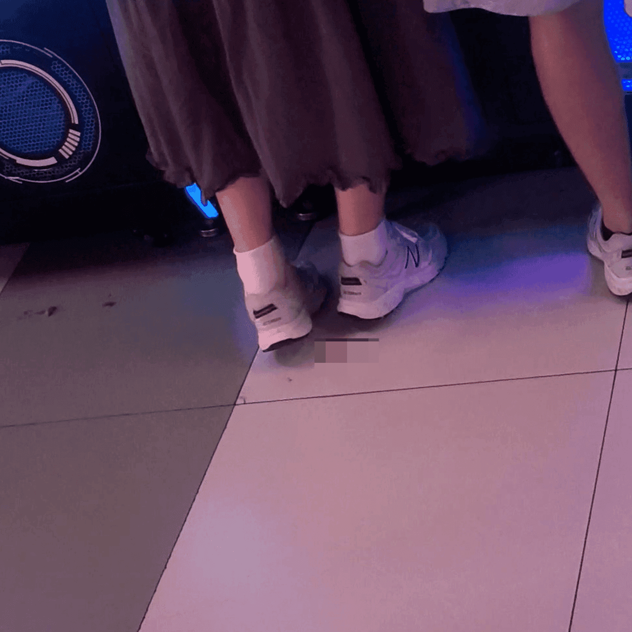 Game arcade woman candid crush with Converse shoes and stiletto heels while playing the basketball shooting machines